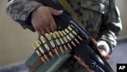 Militiamen loyal to Ata Mohammad Noor, chief of Jamiat-e-Islami and a powerful northern warlord who was a key U.S. ally in the 2001 defeat of the Taliban, stand guard at his office in Mazar-e-Sharif, north of Kabul, Afghanistan, July 8, 2021.