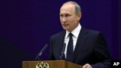 Russian President Vladimir Putin speaks before the officers of the Russian Foreign Intelligence at the headquarters of the Foreign Intelligence Service in Moscow, Russia, June 28, 2017.