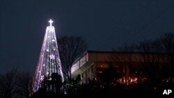 FILE - A giant steel Christmas tree lit up at the western mountain peak known as Aegibong in Gimpo, South Korea, Dec. 21, 2010.