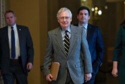 Senate Majority Leader Mitch McConnell of Kentucky walks on Capitol Hill in Washington, Jan. 3, 2020.