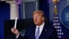 U.S. President Donald Trump shows a packaging containing a swab to be used for coronavirus disease (COVID-19) testing during the daily coronavirus task force briefing at the White House in Washington, U.S., April 19, 2020.