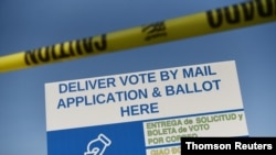 A sign sits outside of a mail ballot drop-off site, which will be closed after Gov. Greg Abbott issued an order limiting each Texas county to one mail ballot drop-off site, in Houston, Texas, Oct. 1, 2020.