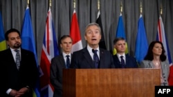 Canadian Foreign Minister Francois-Philippe Champagne addresses the media after a meeting of the International Coordination and Response Group to discuss the downing of a Ukrainian plane in Iran, at the High Commission of Canada in London, Jan. 16, 2020.