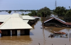 FILE - Houses partially submerged in flood waters are pictured in Lokoja city, Kogi State, Nigeria, Sept. 17, 2018.