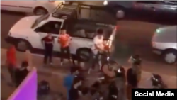 In this screen grab of a video shared on social media on July 15, 2021, Iranian protesters appear to confront police in southwestern Iran's Khuzestan province as part of a wave of demonstrations in the province against water shortages. 