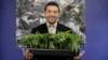 In this Dec. 29, 2017, photo, Khalil Moutawakkil, co-founder and CEO of KindPeoples, poses for a portrait with some marijuana plants in his dispensary in Santa Cruz, Calif.