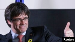 file - Carles Puigdemont, the dismissed president of Catalonia, arrives to speak after watching the results of Catalonia's regional election in Brussels, Belgium, Dec. 21, 2017.