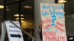 An anti-vaccine protester demonstrates outside the Los Angeles Unified School District administrative offices in Los Angeles Thursday, Sept. 9, 2021. The Los Angeles board of education is expected to vote Thursday on whether to require students 12…