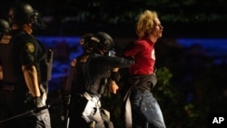Portland police make arrests on the scene of the nightly protests at a Portland police precinct, August 30, 2020 in Portland, Oregon. 