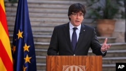 Catalan President Carles Puigdemont speaks during a statement at the Palau Generalitat in Barcelona, Spain, on Saturday, Oct. 28, 2017.
