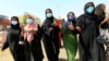 FILE - Women chant slogans during a pro-democracy protest in Khartoum, Sudan, June 30, 2020.