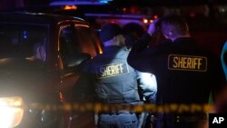 Law enforcement personnel control the scene of a shooting Monday, Jan. 23, 2023, in Half Moon Bay, California. 