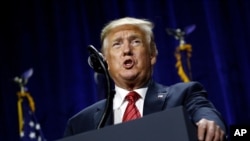 President Donald Trump speaks at the Republican Party of Iowa's annual dinner in West Des Moines, Iowa, June 11, 2019. 