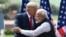 FILE - President Donald Trump shakes hands with India's Prime Minister Narendra Modi during a joint press conference at Hyderabad House in New Delhi, Feb. 25, 2020.