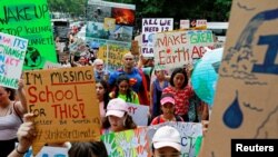 FILE - Environmental activists participate in a Global Climate Strike near the Ministry of Natural Resources and Environment office in Bangkok, Thailand, Sept. 20, 2019.