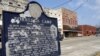 FILE - A plaque describing the origins of the city is seen in Forrest City, Arkansas, Feb. 27, 2009.