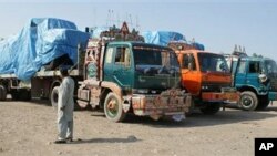 Afghanistan-bound NATO trucks are parked after Pakistani authorities blocked a NATO supply line near the border with Afghanistan, September 30, 2010.