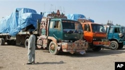 Afghanistan-bound NATO trucks are parked at a roadside as authorities blocked NATO supply line to Afghanistan after NATO allegedly killed three border guards at Pakistani border, at tribal check post of Takhta Beg in Khyber area of Pakistan near Pak-Afgha