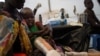 A boy who suffered severe burns to his leg is tended to by a Médecins Sans Frontières (MSF) doctor at the MSF clinic set up at the camp for displaced people in the grounds of the United Nations Mission to South Sudan (UNMISS) base in Juba, South Sudan, o