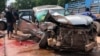 In this photo provided by Cambodia National Police, Cambodia's Prince Norodom Ranariddh's mangled car sits on the side of a road after a collision with another vehicle outside Sihanoukville, Cambodia, Sunday, June 17, 2018. Ranariddh has been seriously injured in the road crash that killed his wife and injured at least seven other people early Sunday. (Cambodia National Police via AP)