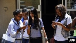 FILE - with the new app on their mobile device, people can receive and share information in real-time in the event of a health crisis, epidemic(s), and natural disasters.