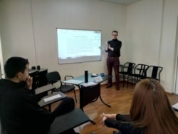 Carl Liles teaches a class in Bishkek, Kyrgyzstan, before the coronavirus pandemic shut down the Fulbright program. (Courtesy photo)