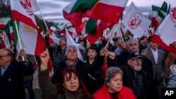 Protesters march past the U.S. Capitol during a rally and vigil in solidarity with ongoing protests in Iran and to honor protesters allegedly killed by the Iranian government on Saturday, Dec. 17, 2022, in Washington. 