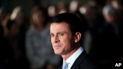 FILE - Outgoing Prime Minister Manuel Valls looks on after the hand over ceremony in Paris, Dec.6, 2016. 