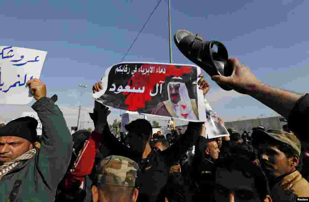 Supporters of Shi'ite cleric Moqtada al-Sadr protest against the execution of Shi'ite cleric Nimr al-Nimr in Saudi Arabia, during a rally in Baghdad, Iraq, Jan. 4, 2016.
