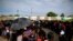 Mainly Haitian along with some African migrants wait in men's and women's lines to request documents giving them temporary legal status in Mexico, outside the Siglo XXI detention center in Tapachula, Mexico, June 12, 2019. 