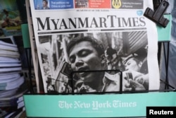 A Myanmar newspaper displays the story about the sentences received by Reuters journalists Wa Lone and Kyaw Soe Oo, on its front page in Yangon, Myanmar, Sept. 4, 2018.