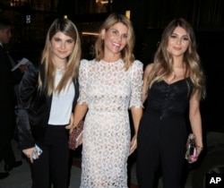 FILE - Actress Lori Loughlin, center, is seen with her daughters Isabella Rose Giannulli and Olivia Jade Giannulli in Los Angeles, Calif.