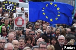 Protesters participate in an anti-Brexit demonstration at City Hall in central Belfast, Northern Ireland, Oct. 20, 2018.