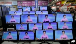 FILE - TV screens show a North Korean newscaster reading a statement from the North's Nuclear Weapons Institute during a news program at the Yongsan Electronic Market in Seoul, South Korea, Sept. 9, 2016.