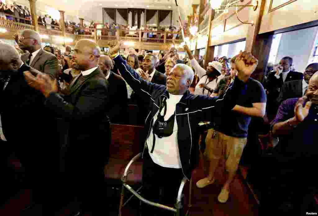 Rev. Sandy Drayton, reacts during a prayer vigil held at Morris Brown AME Church in Charleston, South Carolina, June 18, 2015. 