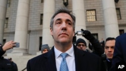 Michael Cohen walks out of federal court Nov. 29, 2018, in New York, after pleading guilty to lying to Congress about work he did on an aborted project to build a Trump Tower in Russia. Cohen said he lied to be consistent with President Trump's "political