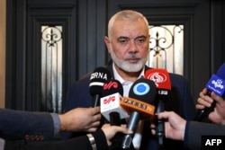 This handout picture provided by the Iranian Foreign Ministry on Dec. 20, 2023, shows Hamas leader Ismail Haniyeh speaking to journalists in Doha, Qatar. (Iranian Foreign Ministry via AFP)