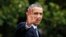 FILE - President Barack Obama waves as he walks towards Marine One on the South Lawn at the White House in Washington.