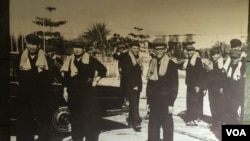 A photograph at Toul Sleng Genocide Museum shows senior Khmer Rouge leaders, September 20, 2016. From left: Pol Pot (General Secretary of the Party and Prime Minister), Noun Chea ("Brother Number Two" and Deputy Party Secretary), Ieng Sary (Foreign Minster), Son Sen (Minister of Defence) and Vorn Vet (Deputy Prime Minister and responsible for the economy. (Nem Sopheakpanha/VOA Khmer) 