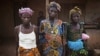 Women who survived the civil war pose for a portrait in the village of Bomaru, where the conflict started in 1991, in eastern Sierra Leone, April 22, 2012.