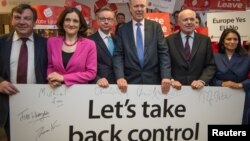 FILE - British politicians (L-R) John Whittingdale, Theresa Villiers, Michael Gove, Chris Grayling, Iain Duncan Smith and Priti Patel pose for a photograph at the launch of the Vote Leave campaign, at the group's headquarters in central London, Feb. 20, 2016. 