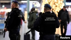 FILE - Dutch police patrol at Amsterdam's Schiphol airport, Nov. 6, 2019. 