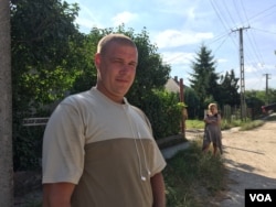Attila Szigeti says he sees the migrants as a threat. He has made up his mind on Hungary's upcoming referendum. (L. Ramirez/VOA)