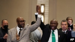 Philonise Floyd (left), who is the brother of George Floyd, and attorney Ben Crump react during a news conference after the guilty verdict was read in the trial of former Minneapolis police officer Derek Chauvin, April 20, 2021, in Minneapolis.
