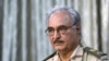 Ex-General Khalifa Haftar attends a news conference at a sports club in Abyar, east of Benghazi, May 17, 2014. 