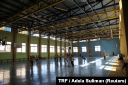 Students at the Al Hoffaz Academy play basketball in their school in Amman, Jordan, Sept. 25, 2018.