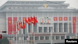 People walk near the venue of a ruling party congress in Pyongyang, North Korea, May 6, 2016.