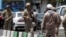 FILE - Members of the Iranian Revolutionary Guard are seen in Tehran, June 7, 2017.