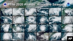 FILE - This combination of satellite images provided by the National Hurricane Center shows 30 hurricanes that occurred during the 2020 Atlantic hurricane season.