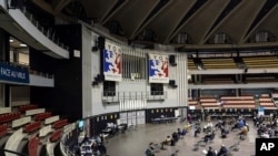 People wait after receiving the Pfizer-BioNTech vaccine against the COVID-19 in a vaccination center of Lyon, France, April 8, 2021. The Pfizer-BioNTech vaccine is more than 97% effective in preventing severe illness and death in a Qatari study.